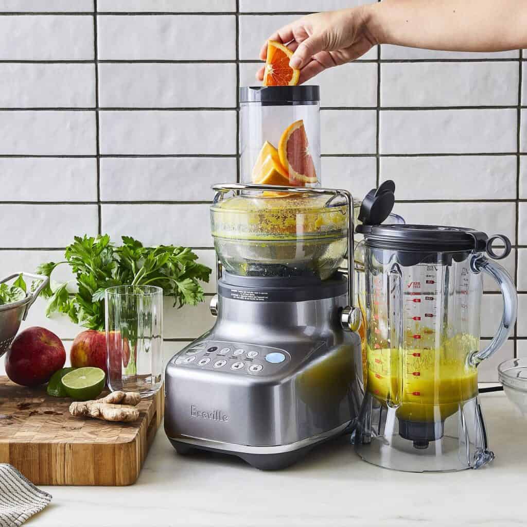 Feed the ingredients into the juicer
