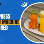 Cold press juicer machine with bottles of fresh cold pressed juice