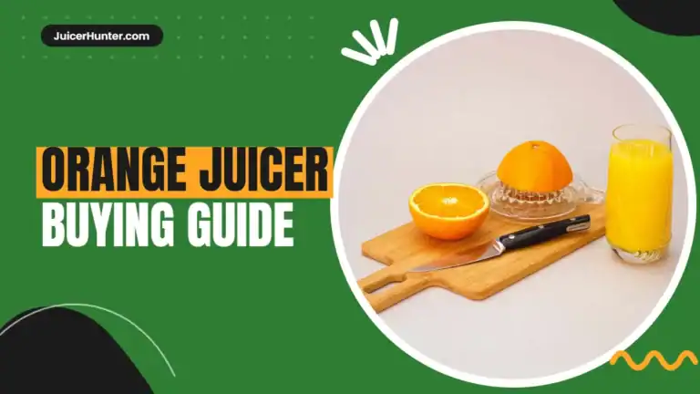 Orange juicer with fresh oranges and a glass of orange juice