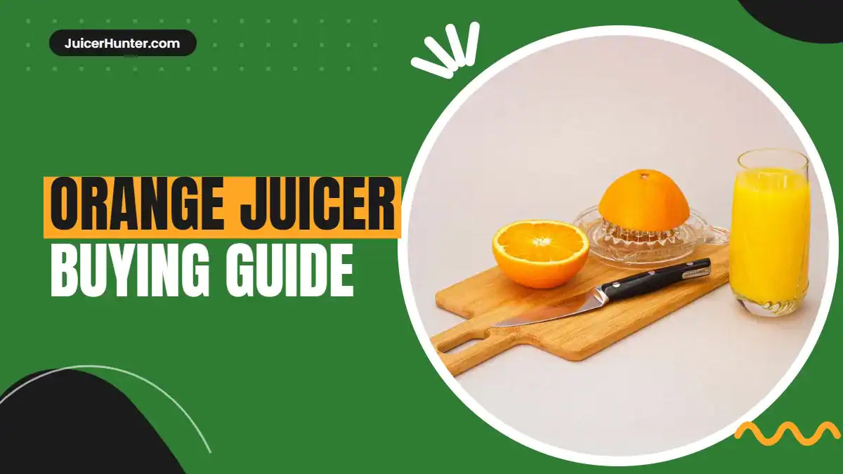 Orange juicer with fresh oranges and a glass of orange juice